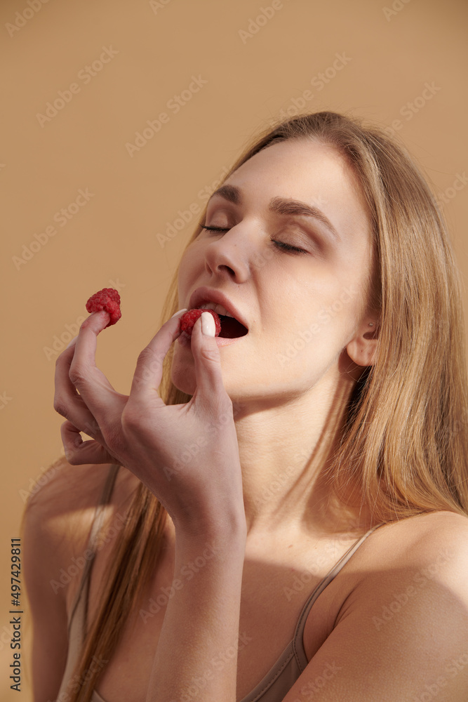 Young happy girl with fresh strawberries Young happy girl with fresh strawberries