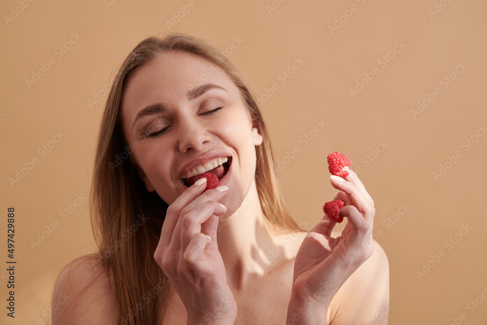 Young happy girl with fresh strawberries Young happy girl with fresh strawberries