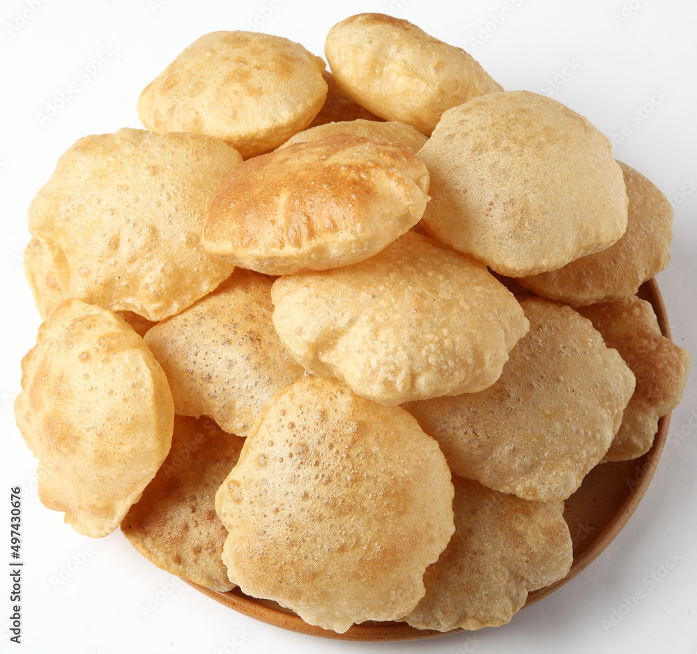 Indian food - Puri Bhaji. North India. Puri is a deep fried bread made from whole wheat flour & Served with Potato curry , bhaji or alu ki sabji.or Potato curry or dum alu curry
