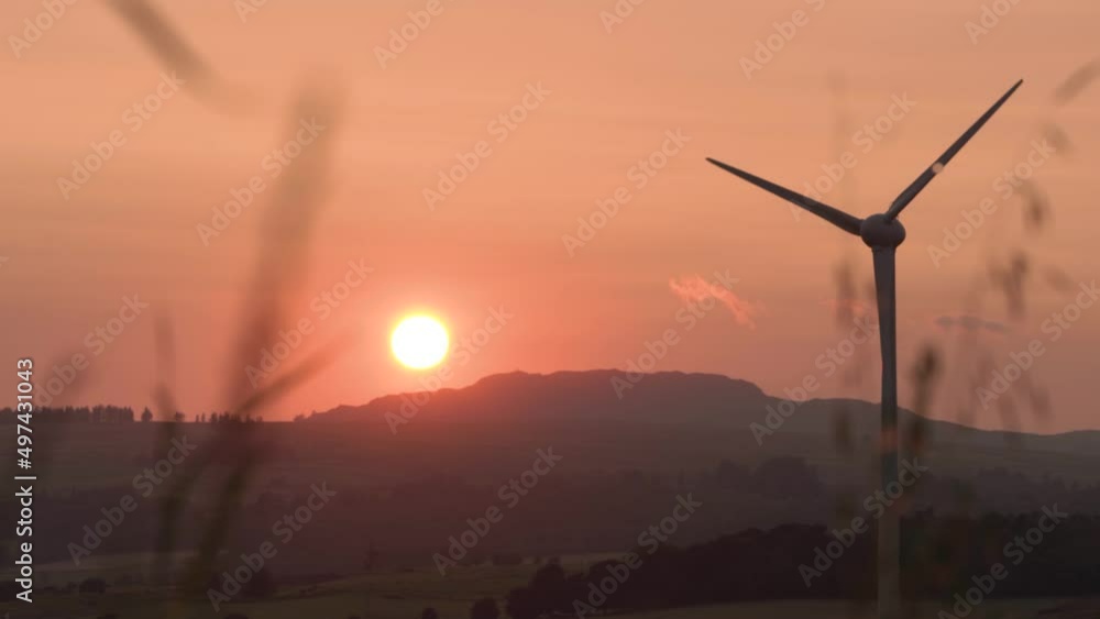 Sunset over Hills Next to Farmland Wind Turbine Sunset over Hills Next to Farmland Wind Turbine