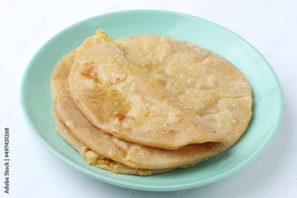 Traditional Indian food Aloo paratha or potato stuffed flat bread. served with curd Traditional Indian food Aloo paratha or potato stuffed flat bread. served with curd