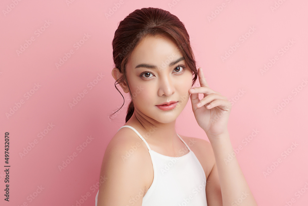 Beautiful young asian woman with clean fresh skin on pink background, Face care, Facial treatment, Cosmetology, beauty and spa, Asian women portrait. Beautiful young asian woman with clean fresh skin on pink background, Face care, Facial treatment, Cosmetology, beauty and spa, Asian women portrait.