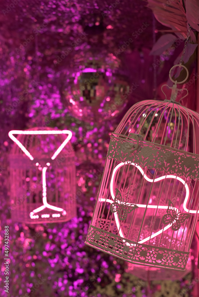 © Viktoriia Pletska - Disco ball and pink cages with neon light © Viktoriia Pletska - Disco ball and pink cages with neon light