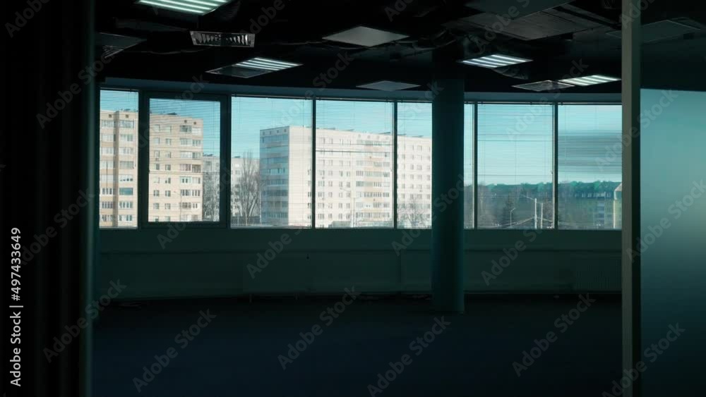 Workspace, the interior of dark office space, a walk through the office inside skyscraper, view of the panoramic window, background template. Workspace, the interior of dark office space, a walk through the office inside skyscraper, view of the panoramic window, background template.