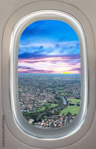 Airplane window view of Sydney NSW Australia. Residential and commercial houses from above 