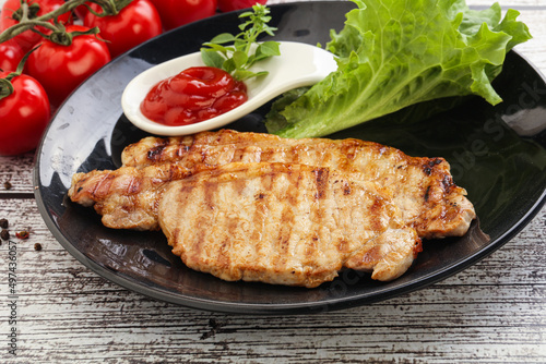 Grilled pork steak with ketchup