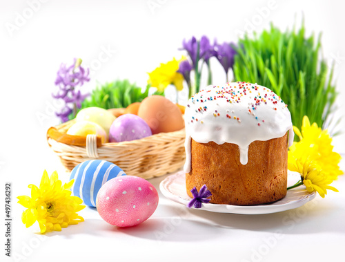 Easter sunny compozition with cake, eggs and flowers. photo