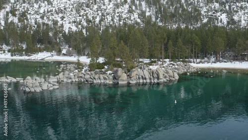 Aerial assent above Sand Harbor Lake Tahoe from the water line.