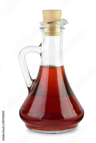Decanter with red wine vinegar isolated on the white background