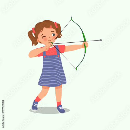 happy cute little girl with bow and arrow doing archery sport aiming ready to shoot