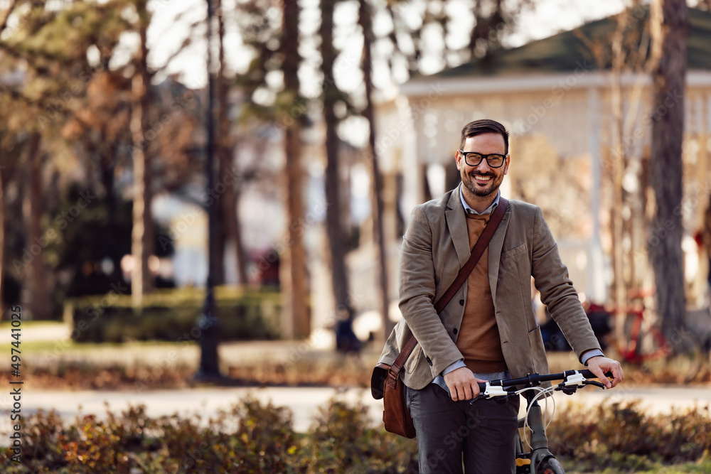 An adult man with a smile on his face, holding a handlebar. An adult man with a smile on his face, holding a handlebar.