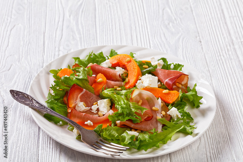 pumpkin salad with lettuce, crumbled cheese, ham