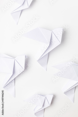 White dove origami as a symbol of peace on a white background