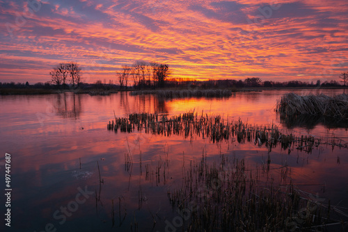 Colorful sky and clouds after sunset over a frozen lake  Stankow  Poland