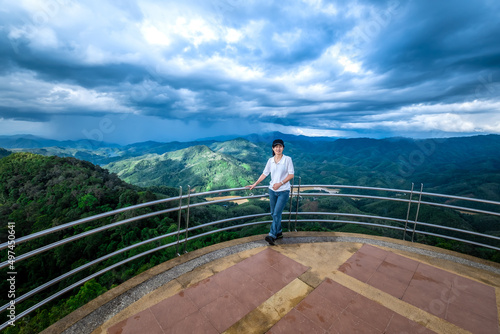 Woman standing on the viewpoint of Aiyoeweng  Betong  Yala Province  Thailand.