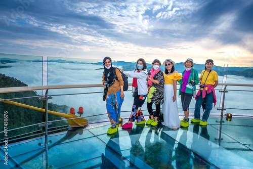 Beautiful top view at Ai Yerweng Skywalk in Yala province, the longest skywalk in Asia. Tourists visit the landmark above the forest . photo