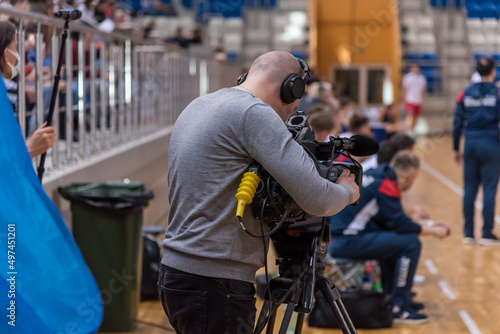 Videographer filming a sporting