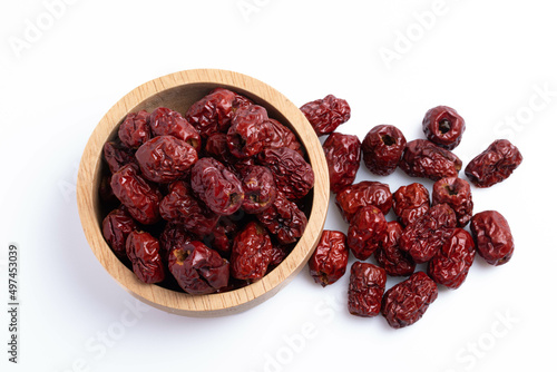 Photos Dried Chinese jujube in a cup on white background