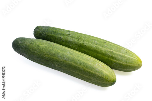 two fresh cucumbers on a white background