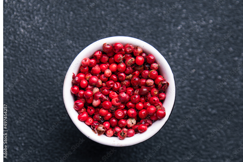 pink peppercorns pepper allspice pepper spices healthy meal food diet snack on the table copy space food background rustic top view pink peppercorns pepper allspice pepper spices healthy meal food diet snack on the table copy space food background rustic top view