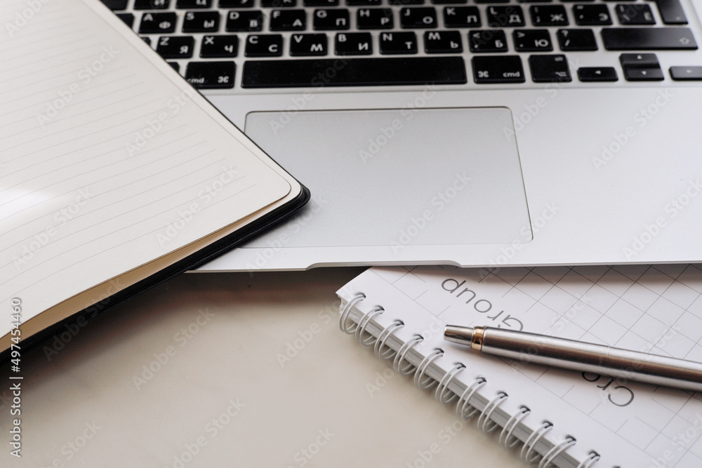 Working office table. On the table is a diary, a workbook, a pen. Working office table. On the table is a diary, a workbook, a pen.