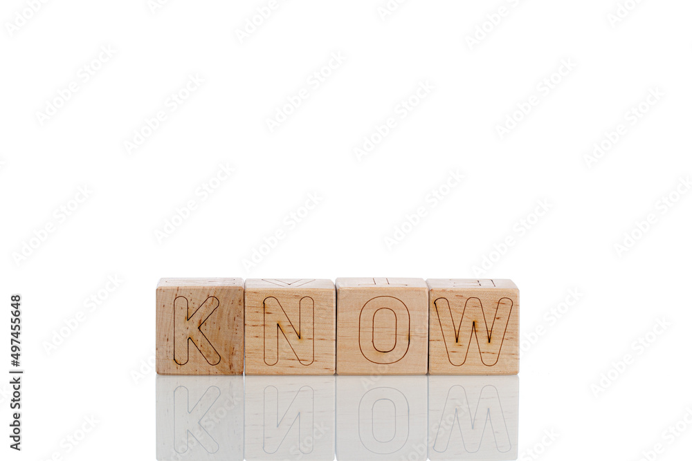 Wooden cubes with letters know on a white background