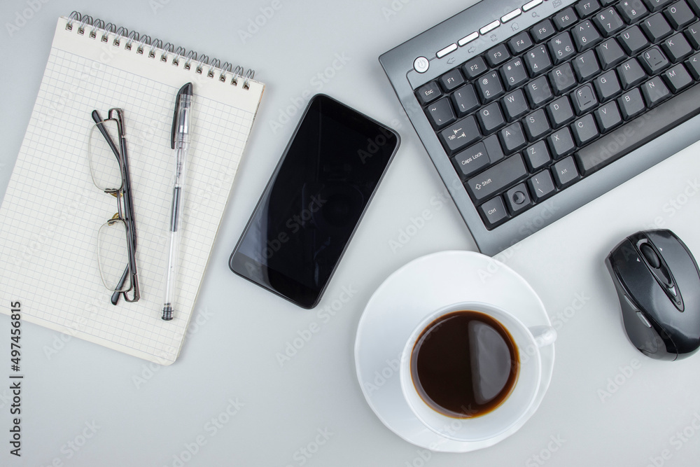 Coffee at workplace, top view of work desk with keyboard and stationery, space for text Coffee at workplace, top view of work desk with keyboard and stationery, space for text