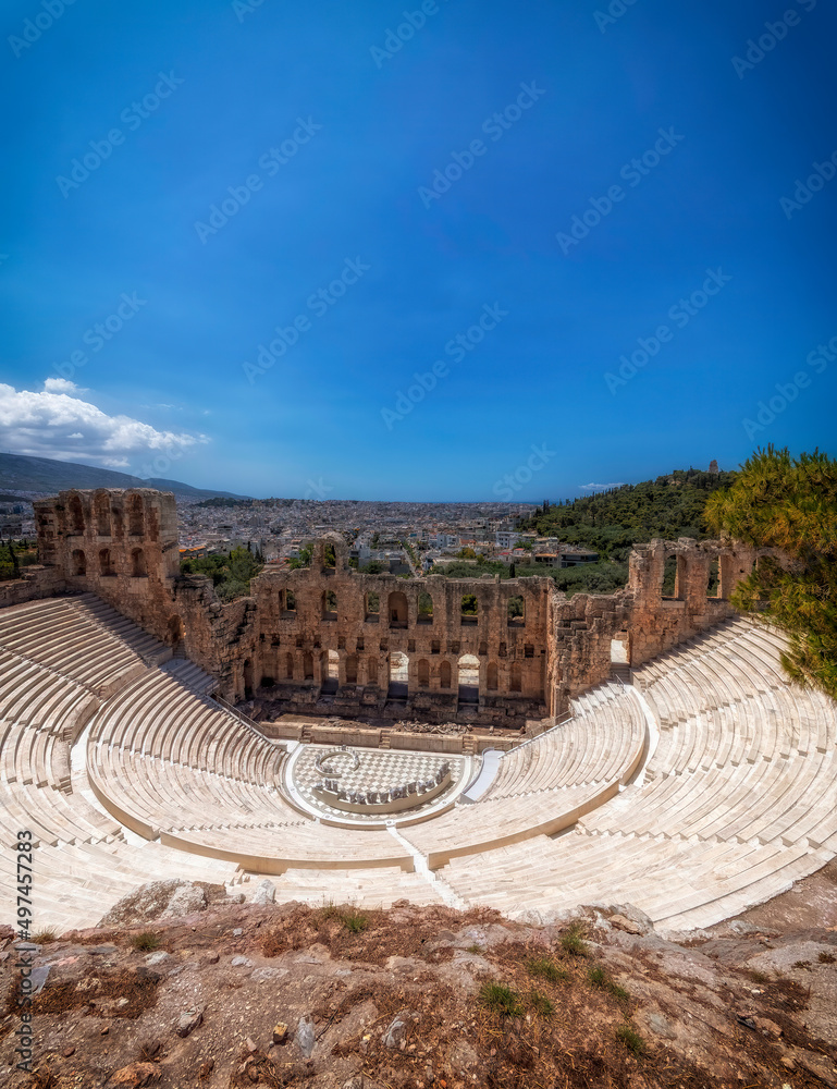 Herodion ancient theater and Athens city view under clear blue sky, Greece