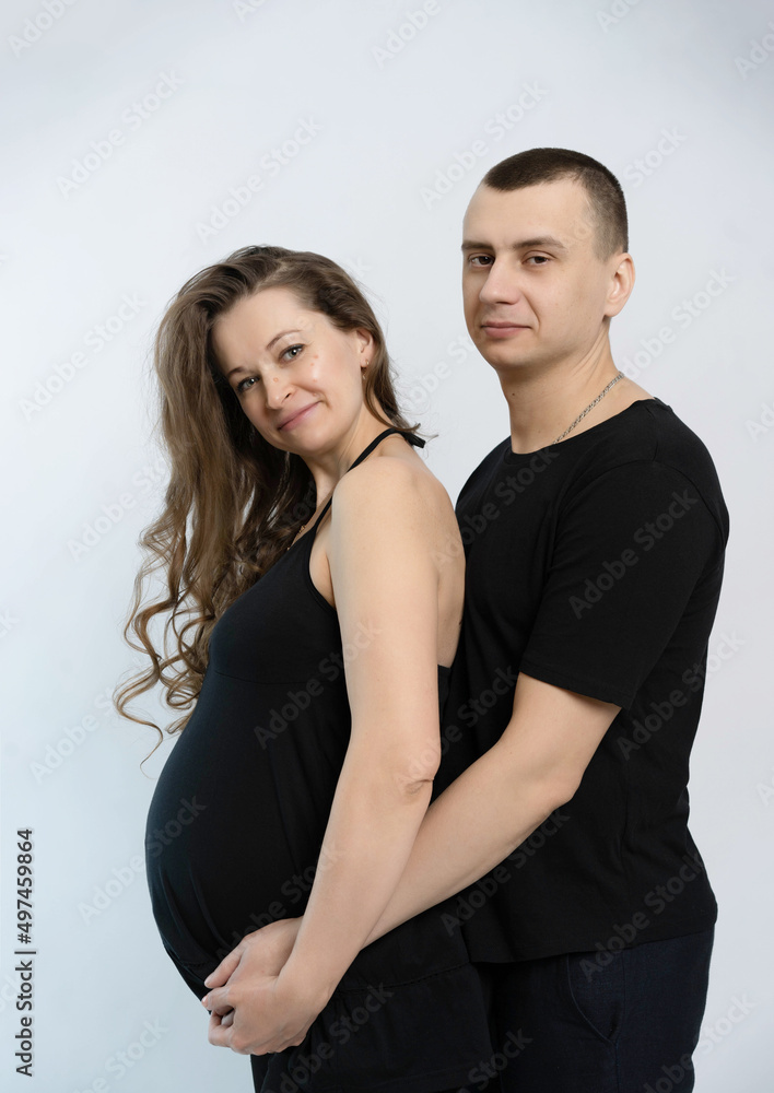 studio portrait of a couple expecting a baby studio portrait of a couple expecting a baby