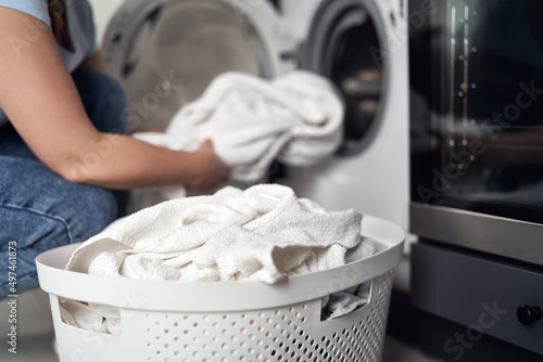 Close up of caucasian woman making laundry at home