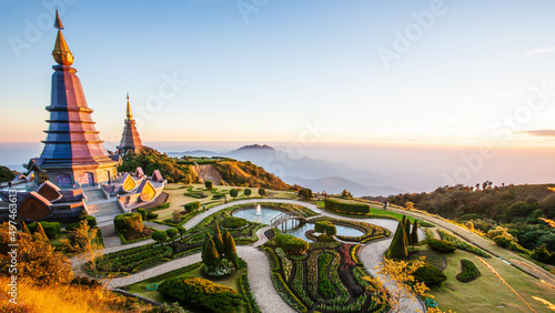 The scenery of two pagodas on the mountain during sunrise. © Tanes