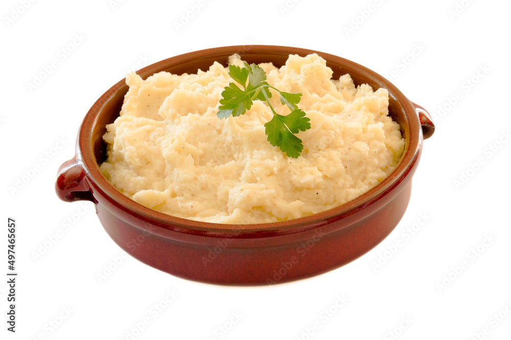 mashed potatoes in an earthen dish on a white background mashed potatoes in an earthen dish on a white background