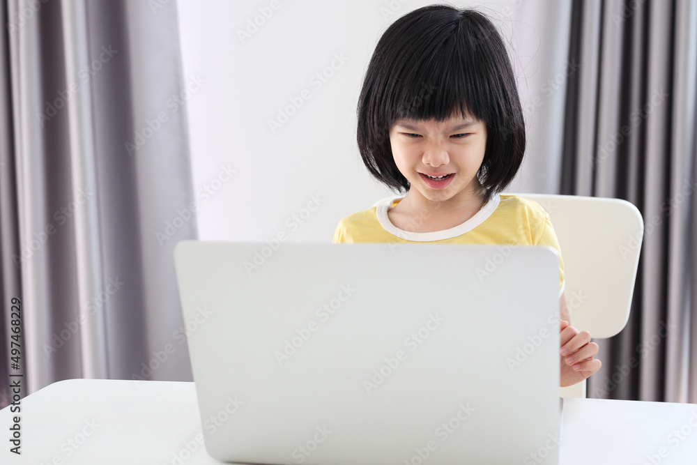 little asian girl student study online using laptop computer at home little asian girl student study online using laptop computer at home