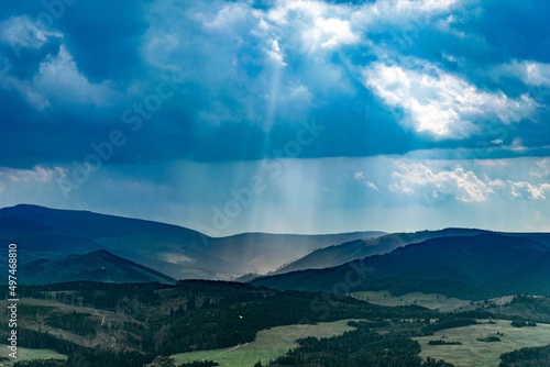 mountain view with sunlight and clouds