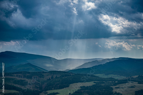 mountain view with sunlight and clouds © herrkl