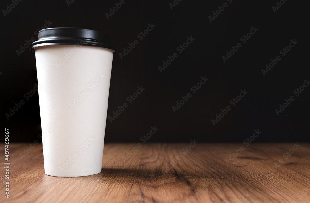 white coffee cup on dark wooden background white coffee cup on dark wooden background
