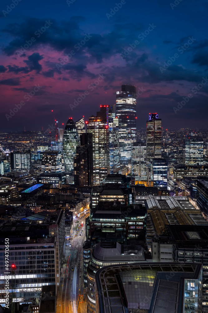 Elevated view of the illuminated Liverpool Street and the City of London during night time