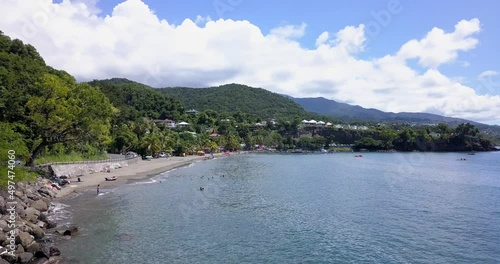 Wallpaper Mural A beach with palm trees and vacationing tourists in Guadeloupe Torontodigital.ca