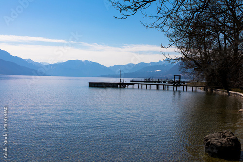 Panoramic view of Lake Attersee with wooden pier and mountain range in the background. Salzkammergut Upper Austria © familie-eisenlohr.de