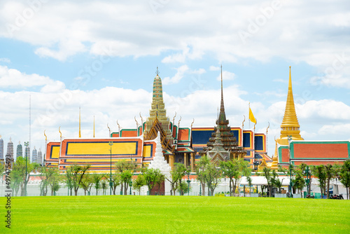 Grand palace or well known among tourist as Temple of the Emerald Buddha or local known Wat phra keaw at on a cloudy blue sky day at Bangkok, Thailand. photo