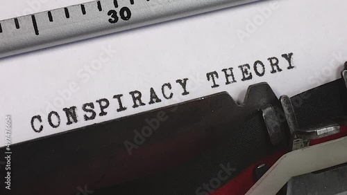 Typing a Conspiracy Theory on an old manual typewriter. A plot or plan to carry out something harmful or unlawful.