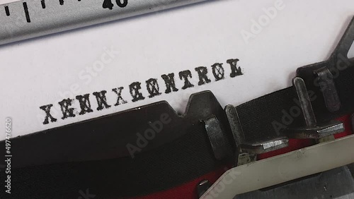 Blocking out or stopping Gun Control on an old manual typewriter. Censorship of sensitive control measures. Obscuring or redacting gun control. Freedom from the control of guns.