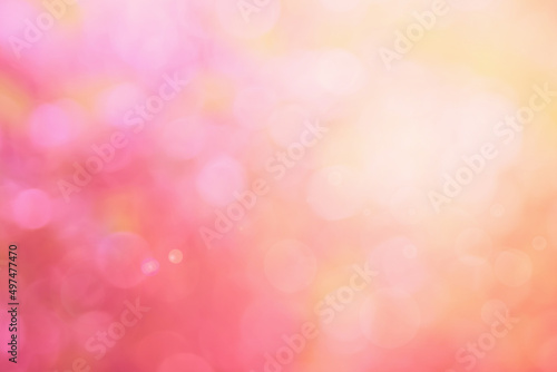 Abstract blurred orange color and peach for background, Blur festival lights outdoor and pink bubble focus.