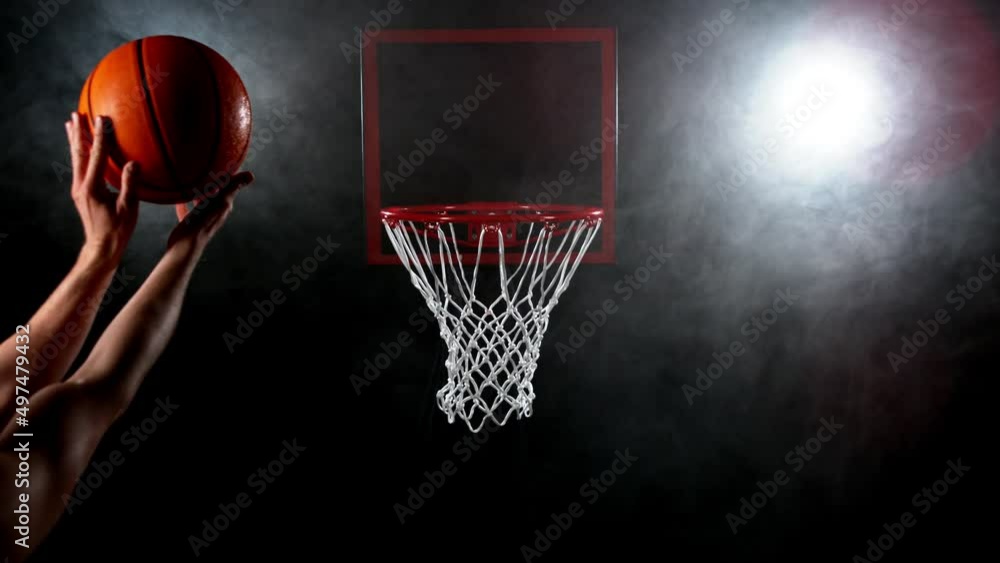 Super slow motion of basketball player hitting the basket. Filmed on high speed cinema camera Phantom, 1000fps. Super slow motion of basketball player hitting the basket. Filmed on high speed cinema camera Phantom, 1000fps.