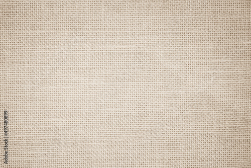 Jute hessian sackcloth burlap canvas woven texture background pattern in light beige cream brown color blank decoration.