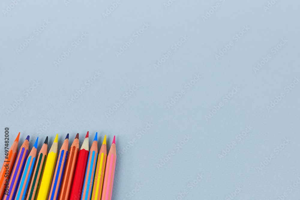 colored pencils on a blue background colored pencils on a blue background