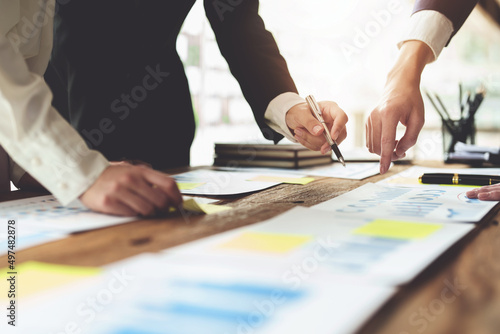 Brainstorming  Consulting  Data Analysis  Planning  Marketing and Accounting  Economist pointing to investment documents with partners on profit taking to compete with other companies.