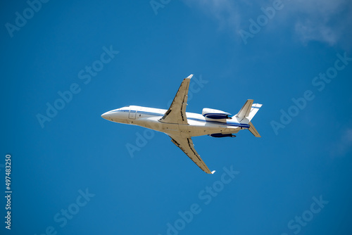 Private Jet Flying Overhead blue sky airplane