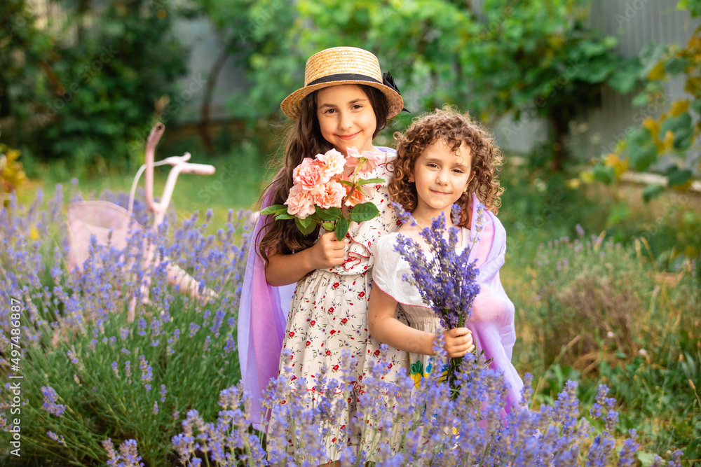 Romantic portrait o charming sisters in straw hats Romantic portrait o charming sisters in straw hats