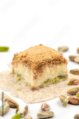 Cold baklava on a white background. Cold baklava prepared with milk and pistachio is very popular. Traditional Mediterranean cuisine delicacies. close-up cold baklava. local name soguk baklava
